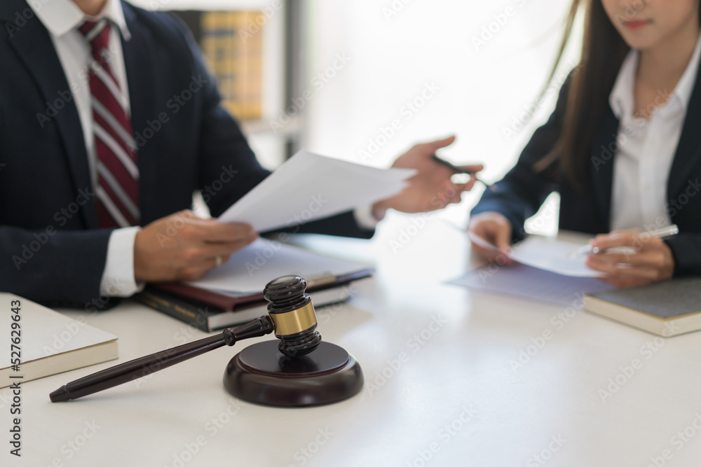 Law and justice concept, Lawyer team discuss about contract and agreement of business in law firm Law and justice concept, Lawyer team discuss about contract and agreement of business in law firm