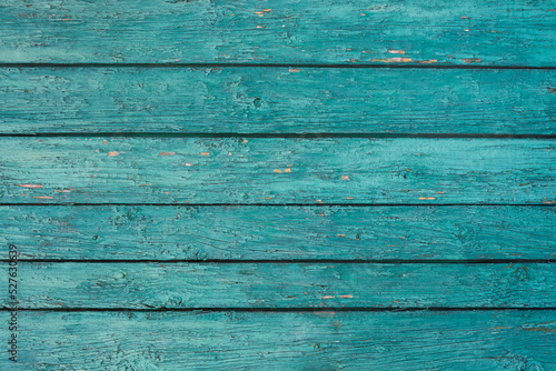 Wood background texture. Wooden surface, old boards, blue-green paint, blank retro template for advertising lettering, rough material, grungy textured background closeup.