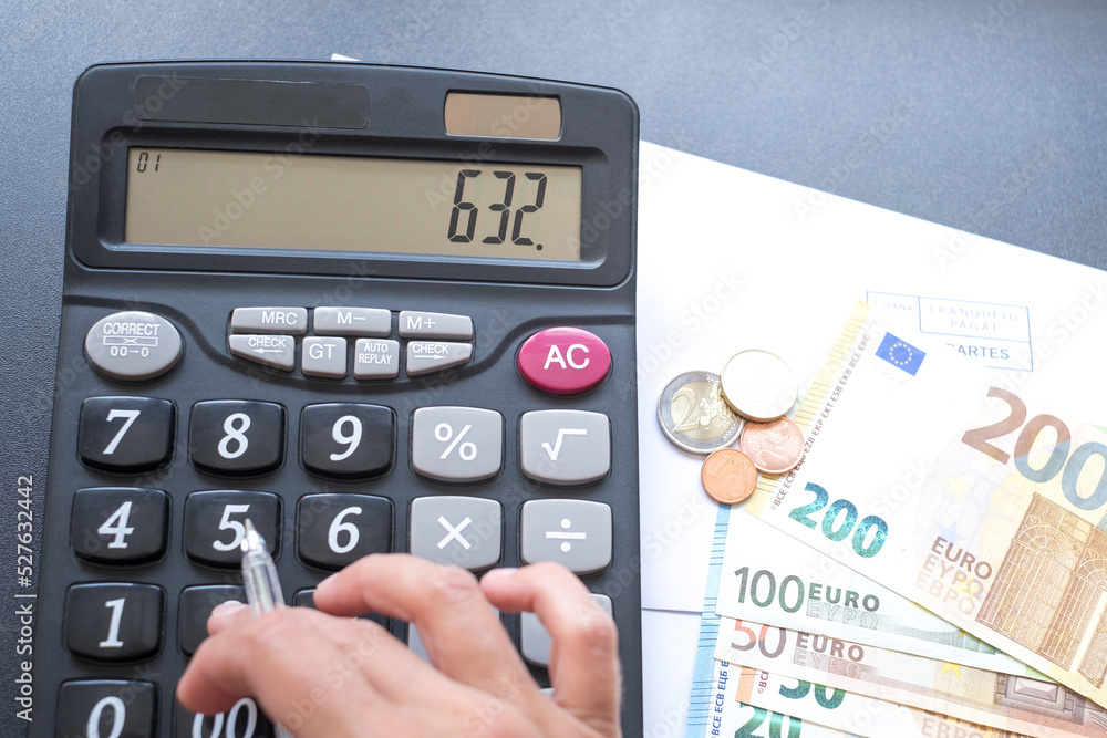 Calculator, money, pen and envelope on the table. Counting money, utility bills, payment for gas and electricity. Pension calculation Calculator, money, pen and envelope on the table. Counting money, utility bills, payment for gas and electricity. Pension calculation