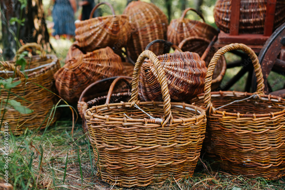 Pile of wicker baskets outdoors, close-up