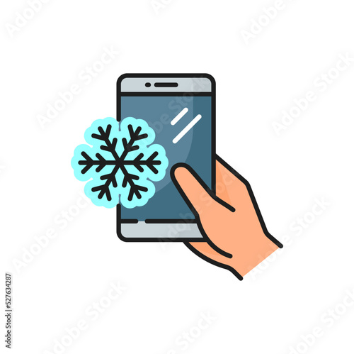 Snowflake on smartphone screen in hand, outline color icon. Vector gadget with snow flake, cellphone with message about snowfall, slipperiness. Mobile device with winter weather forecast