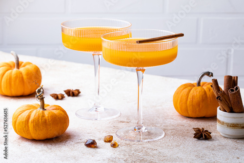 Halloween, Thanksgiving or fall cocktail pumpkin martini, homemade festive seasonal drink pumpkintini with cinnamon