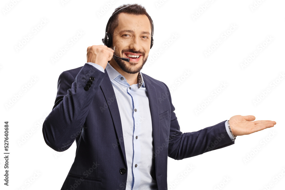 Professional man with a headset and hands free microphone showing with hand Professional man with a headset and hands free microphone showing with hand