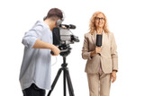 Cameraman recording a female reporter with a microphone