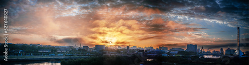 Dramatic sunrise sky over urban landscape of Glasgow Scotland