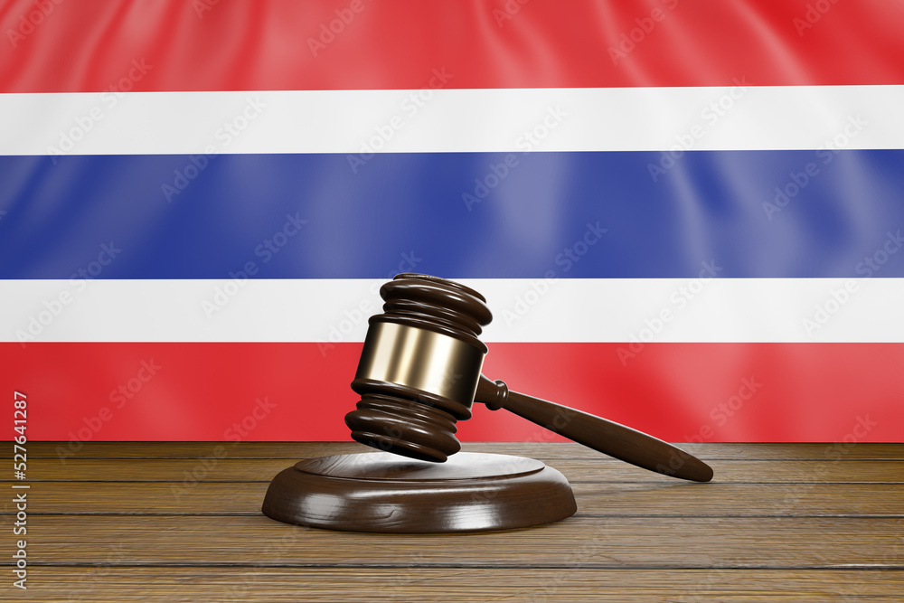 Court gavel on a wooden table with the flag of Thailand as background. Illustration of the concept of Thai legislation and judgement
