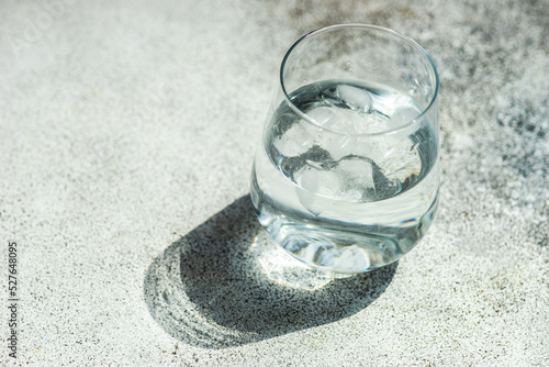 Glass of clear water with ice