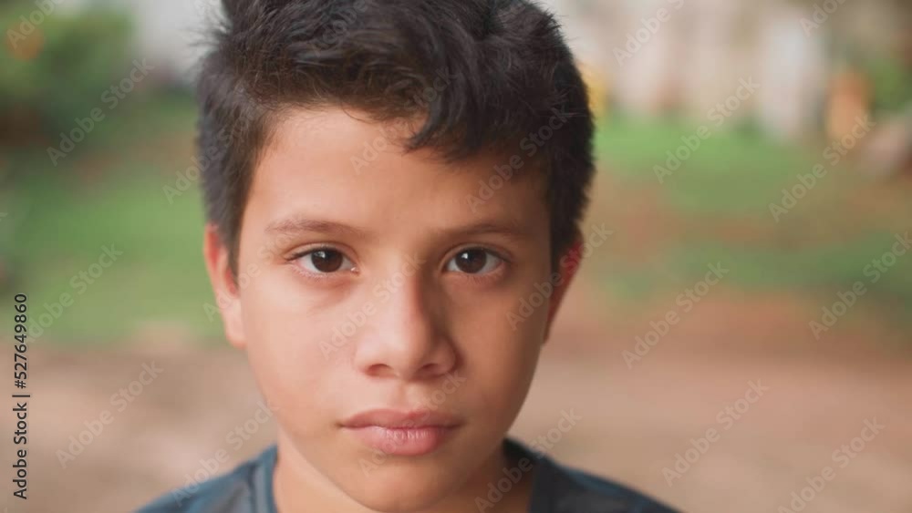 latino child sitting looking at the camera, close-up latino child sitting looking at the camera, close-up