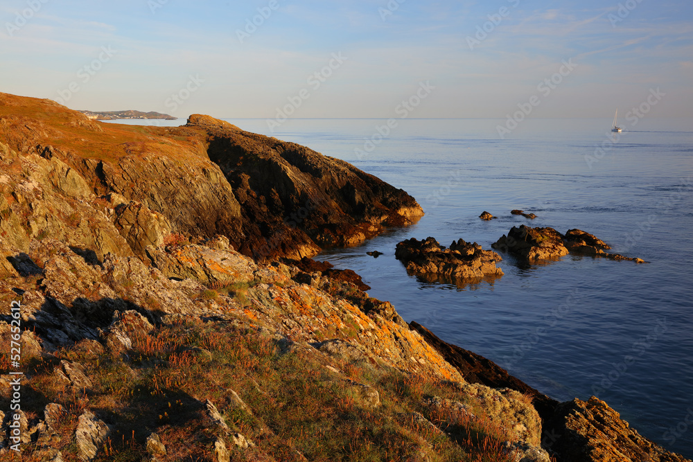Warm Morning light at Lynas Point with Amlwch just visable in the distance. Anglesey, North Wales, UK.