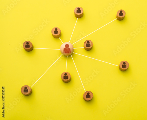 Representation with 3d icons of a network of social media contacts on a yellow background