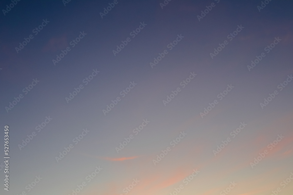 Colourful sky and clouds sunset background. Real amazing sunrise or sunset sky with gentle colorful clouds.