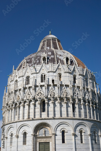 Pisa, Tuscany, Italy 08-28-2022. Details the architecture of the Pisa Baptistery, dedicated to Saint John the Baptist, faces the cathedral at the western end of the Piazza dei Miracoli.