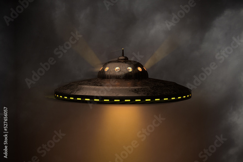 An unidentified flying object (UFO) against a moody sky. Lightrays visible. Slight motion unsharpness (halo). 3d render photo
