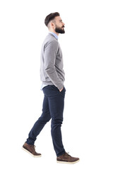 Confident successful smart casual businessman walking with hands in pockets. Full body isolated on transparent background.