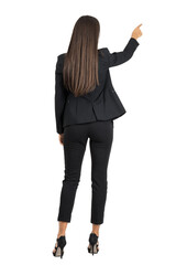 Rear view of long dark hair beauty pointing or presenting on her right side isolated	on transparent background
