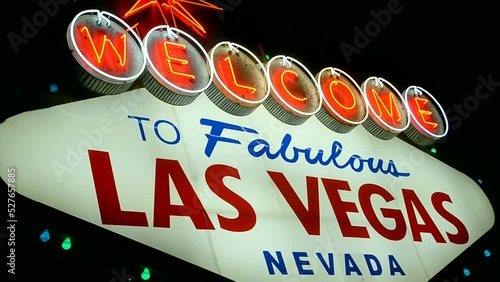 Las Vegas sign with red blinking led light on dark night sky, Nevada, USA. Welcome to fabulous sin city, entertainment diversity