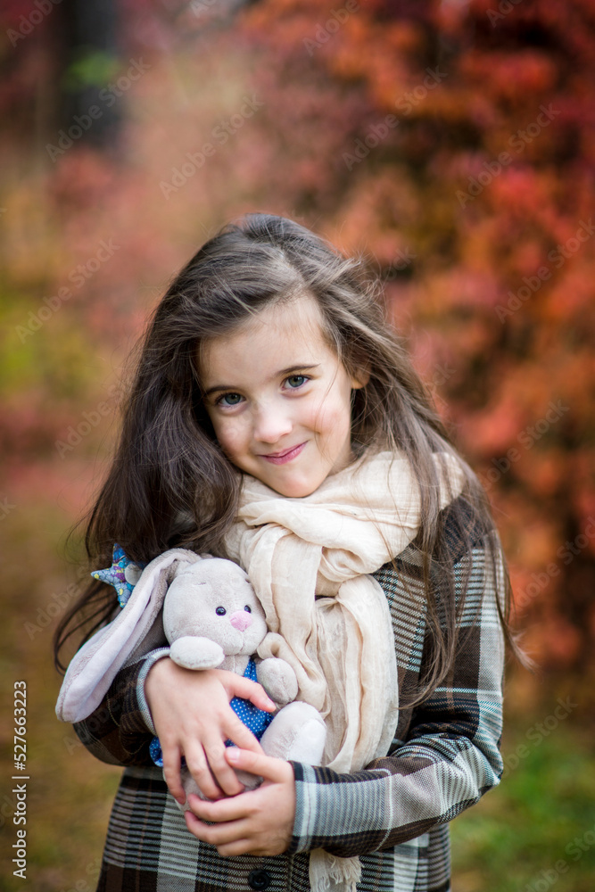 adorable little girl with autumn leaves in the beauty park adorable little girl with autumn leaves in the beauty park