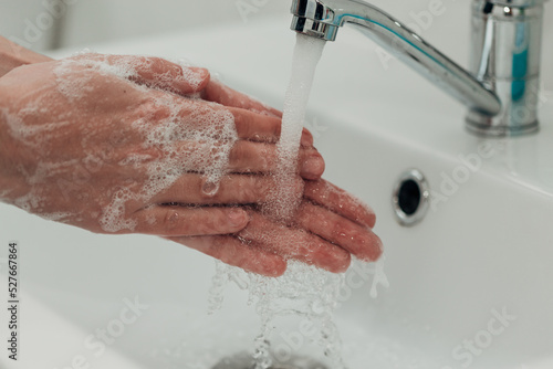 The Girl Washes Her Hands to Avoid Infection With the Virus COVID-19