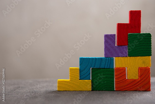 Creative idea solution - business concept, jigsaw puzzle on the grey background. Leadership and teamwork strategy success.