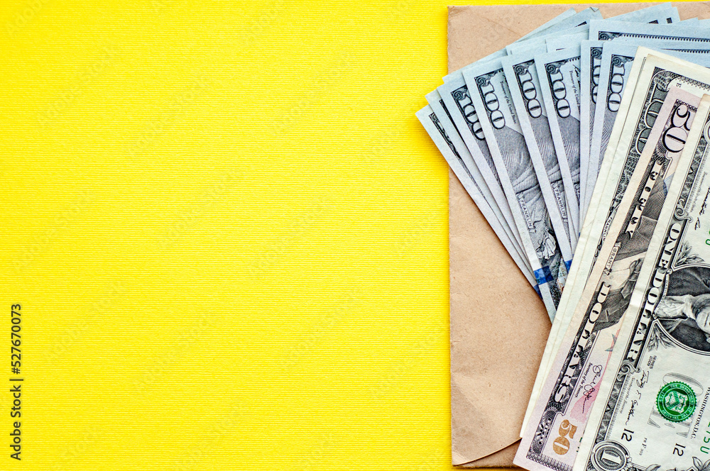 Cash on the table, yellow background, money, us dollars, place for text, flat lay,  space for text - obrazy, fototapety, plakaty 