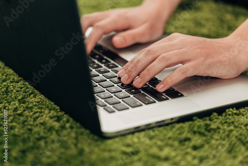 Close-Up Shot of Human Hands Placed Over Laptop
