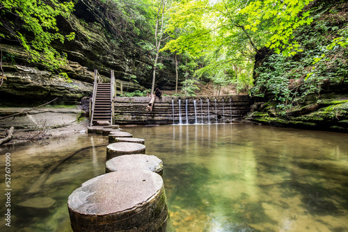 Concrete stepping stones weaving through a canyon in Matthiessen State Park. photo