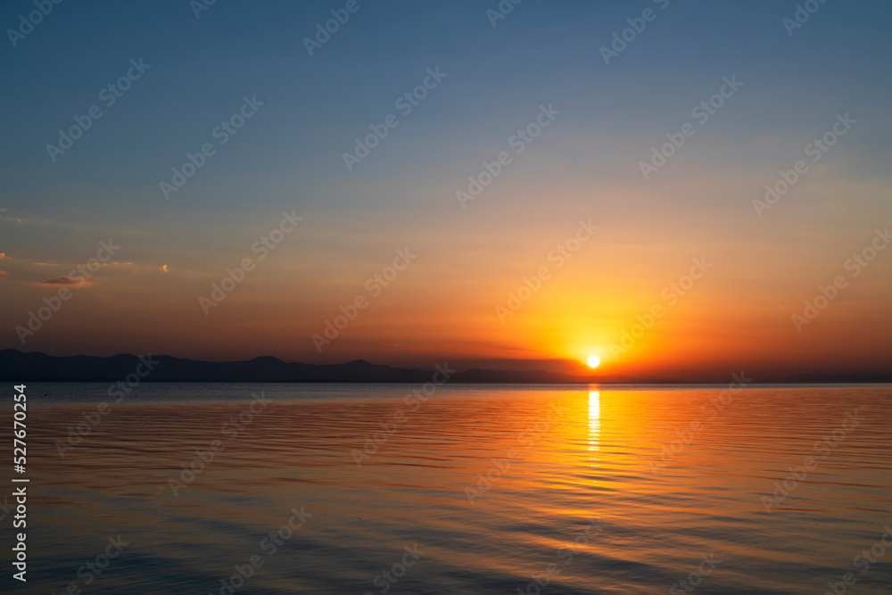 Beautiful golden sunset over the lake. Sunset landscape.