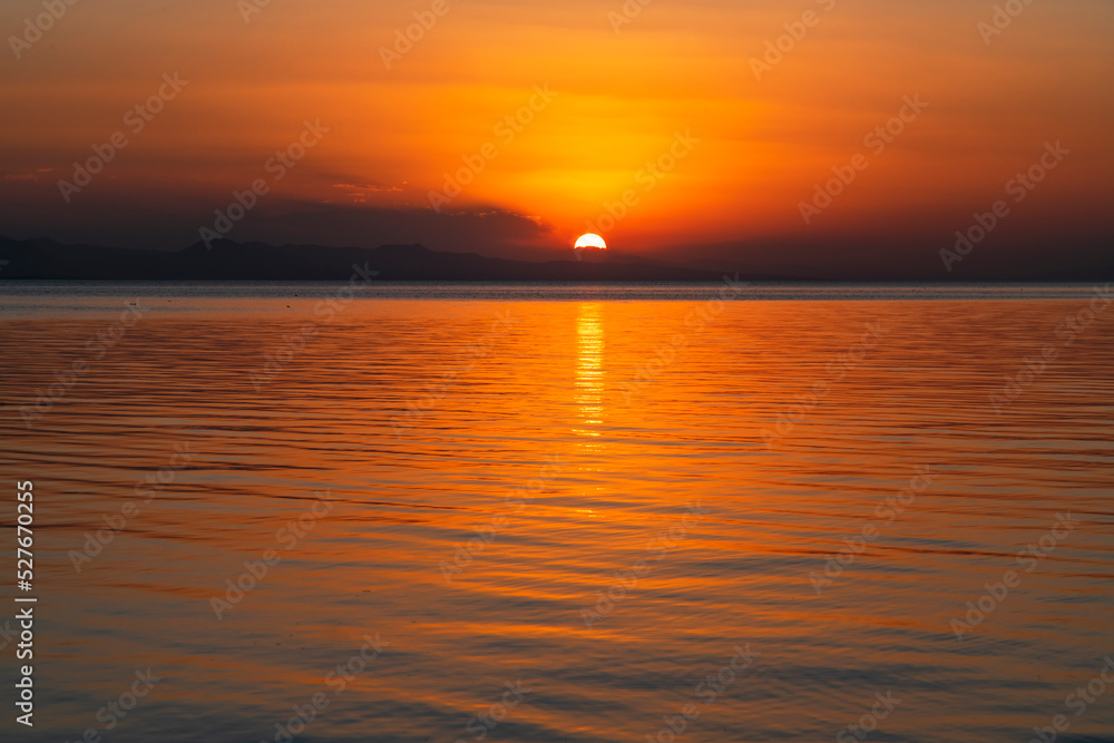 Beautiful golden sunset over the lake. Sunset landscape.