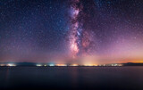 Night landscape. Beautiful lake in the night under  starry sky with bright miky way galaxy.