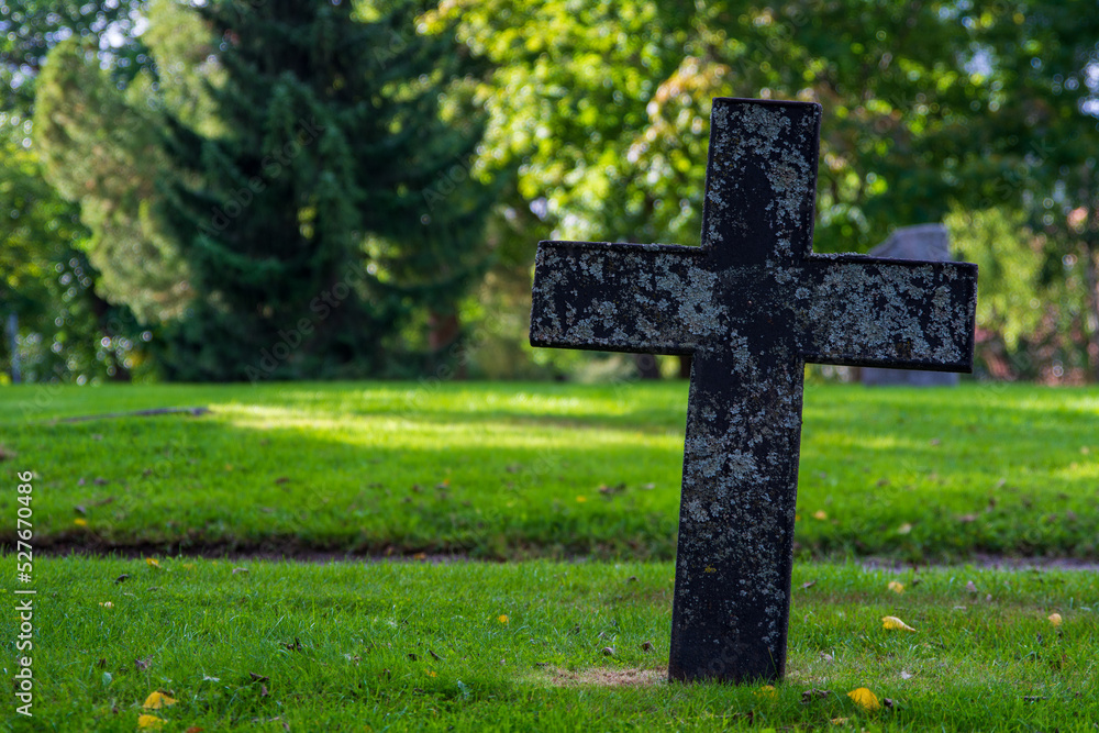 A Stone cross on a meadow