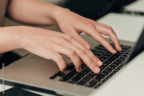Close-Up Shot of Human Hands Placed Over Laptop
