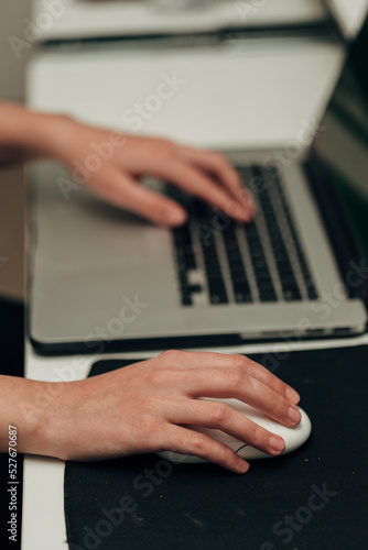 Close-Up Shot of Human Hands Placed Over Laptop