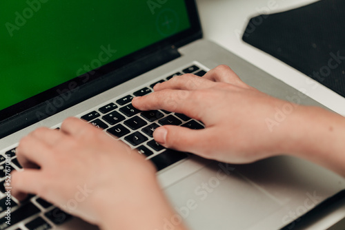 Close-Up Shot of Human Hands Placed Over Laptop