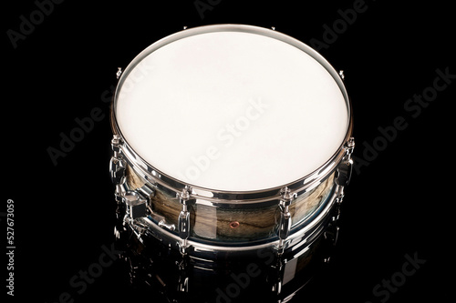 
beautiful snare drum on a black background with reflection, for advertising and inscription photo