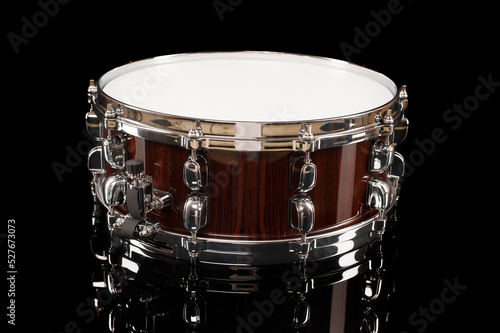 
beautiful snare drum on a black background with reflection, for advertising and inscription