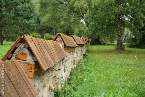 stone fence with tiles