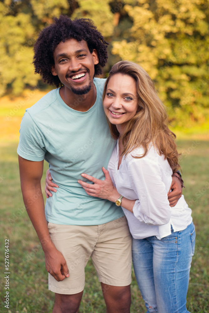 Young mixed race couple walking in the summer nature Young mixed race couple walking in the summer nature