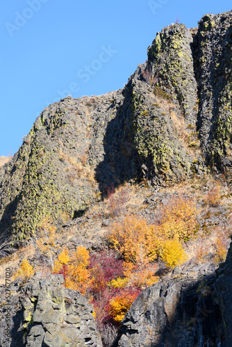 Basalt cliffs with fall colors and blue sky in Central Washington State © IanDewarPhotography