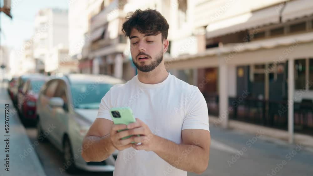 Young hispanic man smiling confident having video call at street Young hispanic man smiling confident having video call at street