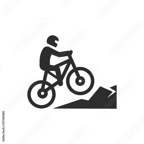 Mountain biking icon. Man on mountain bike riding down the mountain. Monochrome black and white symbol