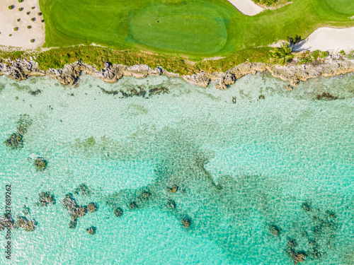 aerial view of golf course by the ocean