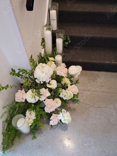 Flowers at base of stairs wedding