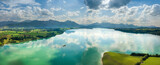 Aerial drone view panorama of Forggensee close to Füssen during summer with the Alps in the background