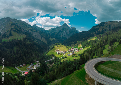 Obraz na płótnie Beautiful austrian valley with village of Oberboden close to a nice road bridge with a hairpin turn on it with magnificent panorama of the mountains. w salonie