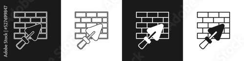 Set Brick wall with trowel icon isolated on black and white background. Vector
