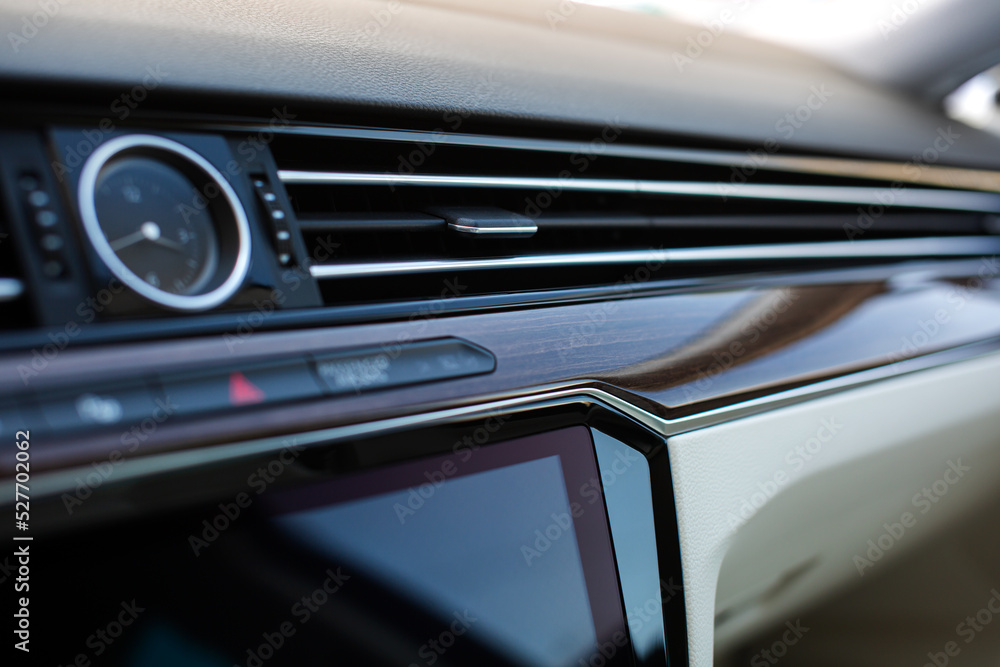 Air vent grill in luxury car. Сar air conditioner, buttons, display. 
