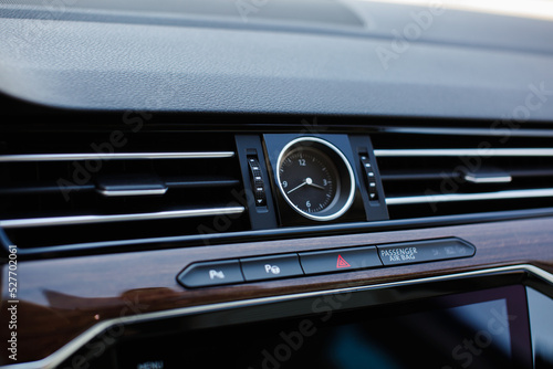 Luxury car clock and air vent.