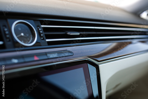 Air vent grill in luxury car. Сar air conditioner, buttons, display.  © kucheruk