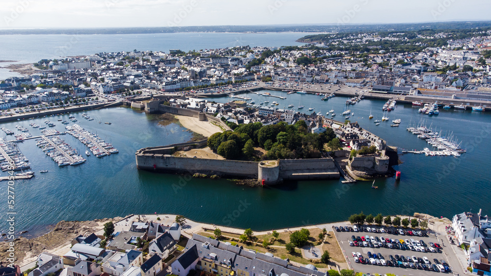 Aerial view of Concarneau, a medieval walled city in Brittany, France - Sandy beach under the fortifications of this island located in a bay along the coast of the Atlantic Ocean