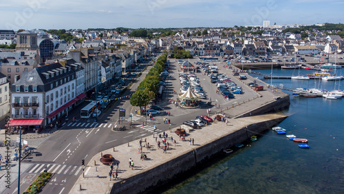 Aerial view of Concarneau, a medieval walled city in Brittany, France - Embankment with a modern parking and a carrousel photo